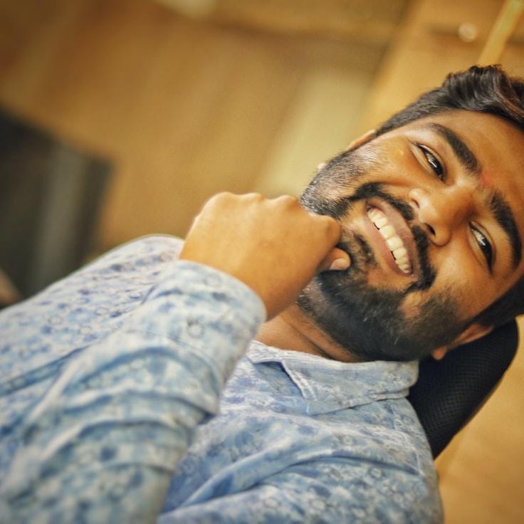 Alex Carter, Lead Design Curator at Silver Mountain Station, reviewing corporate floral arrangements